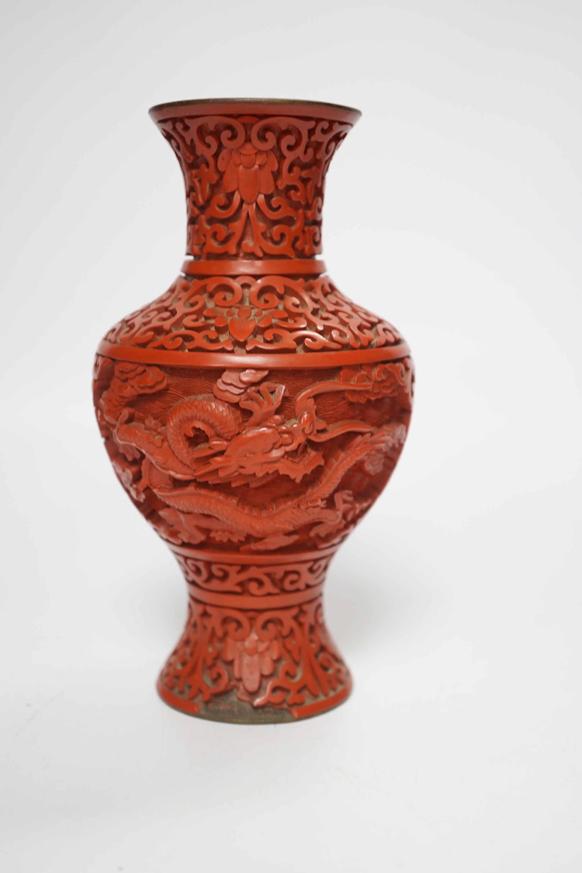 Three Chinese cinnabar lacquer items, a vase, an ashtray and a lidded box, vase 16.5cm